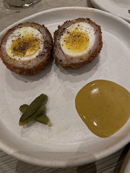 Group photo of six members at dinner